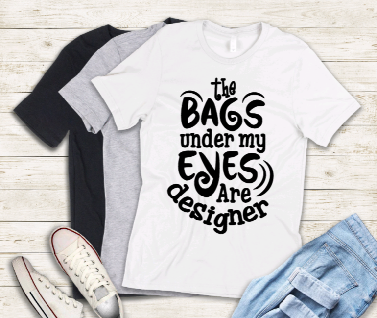 The bags under my eyes are designer adult t-shirt